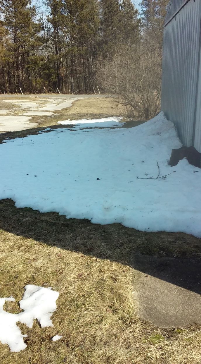 snow up against garage 030921