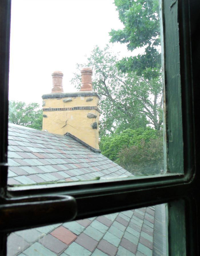 resized looking out turret window on stairway going to 4th fl 060221