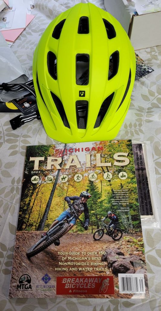 resized cropped 070323 new helmet and 2023 trails mag