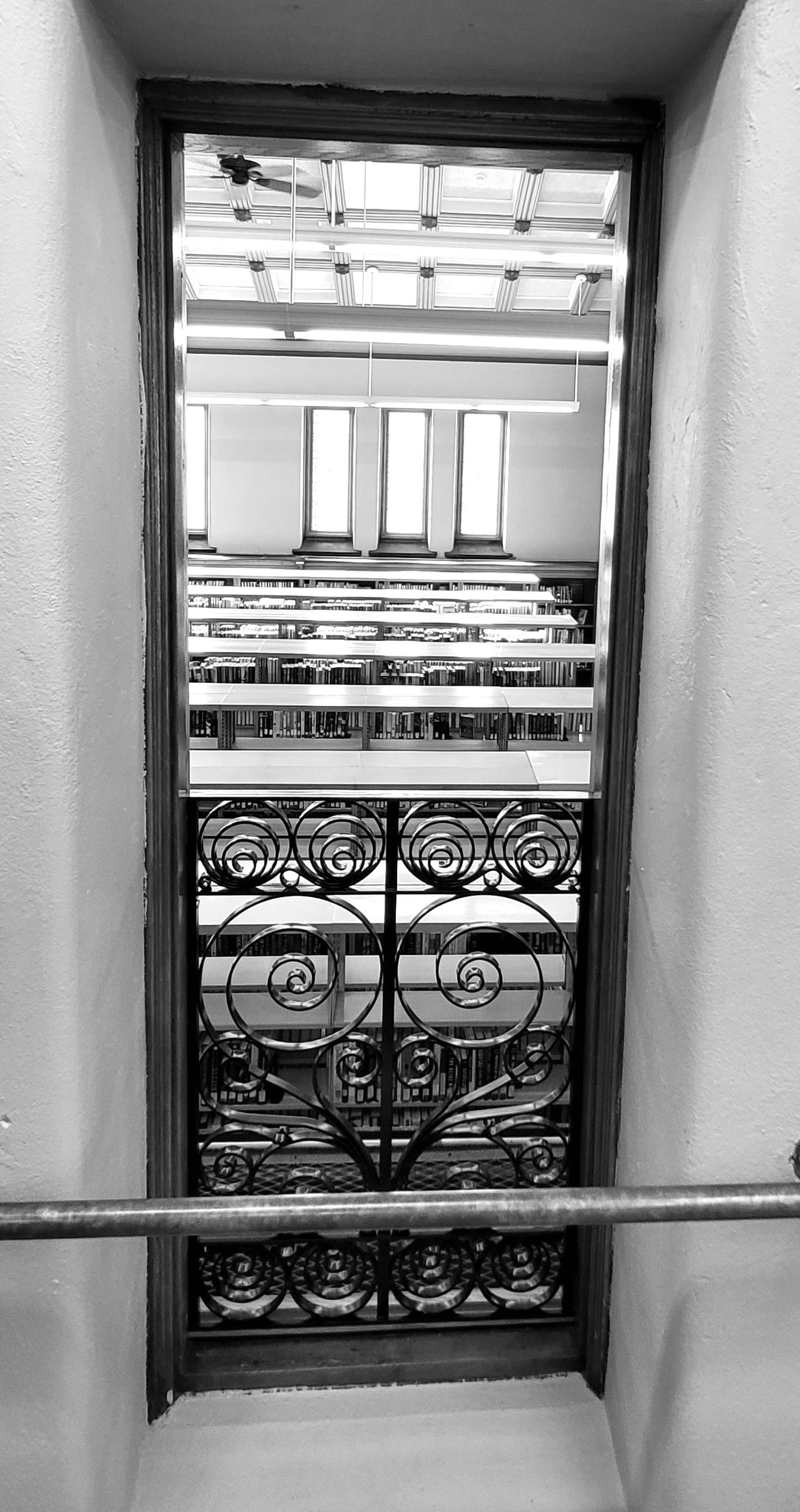 resized hackley library 11 upper floor window looking down on main floor greyscale 20231116_133449